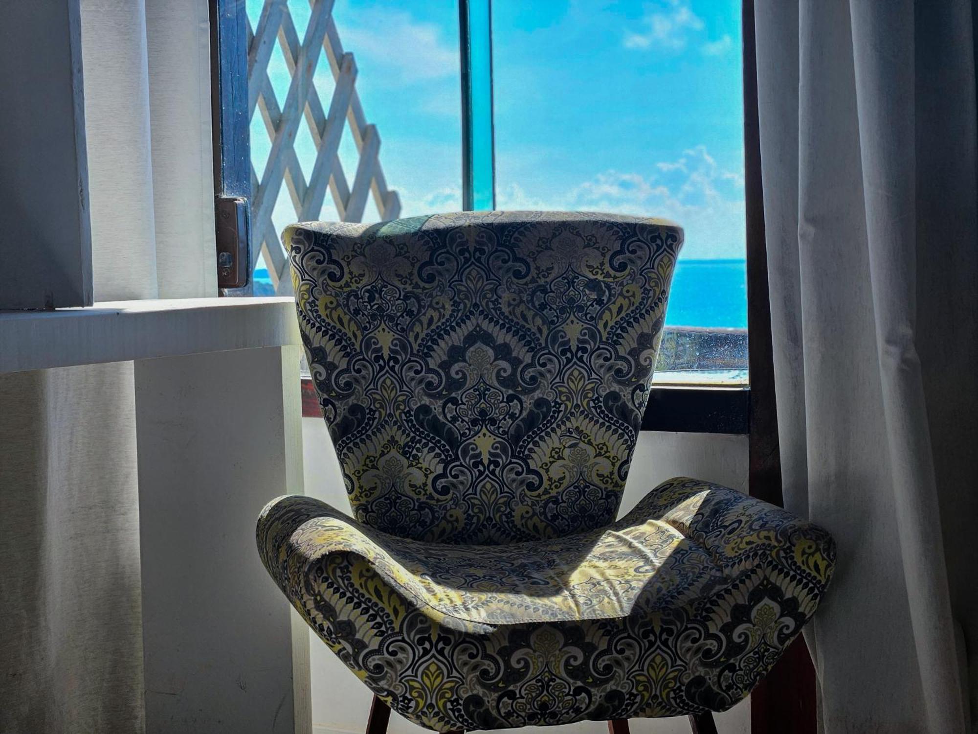 Bella Vista Ocean View Hotel Búzios Kültér fotó A chair in a hotel room